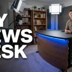DIY news desk build: Man in studio with broadcast anchor desk